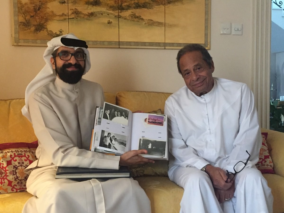 Mohamed Yehia Zakaria showing me some photos of when he arrived in Dubai in 1962. Photo credit: Ahmed Zakari
